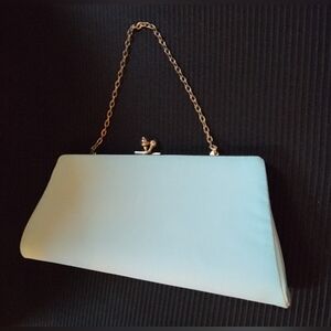 Geat Condition-Stylish light green/mint color clutch. Has a gold chain strap